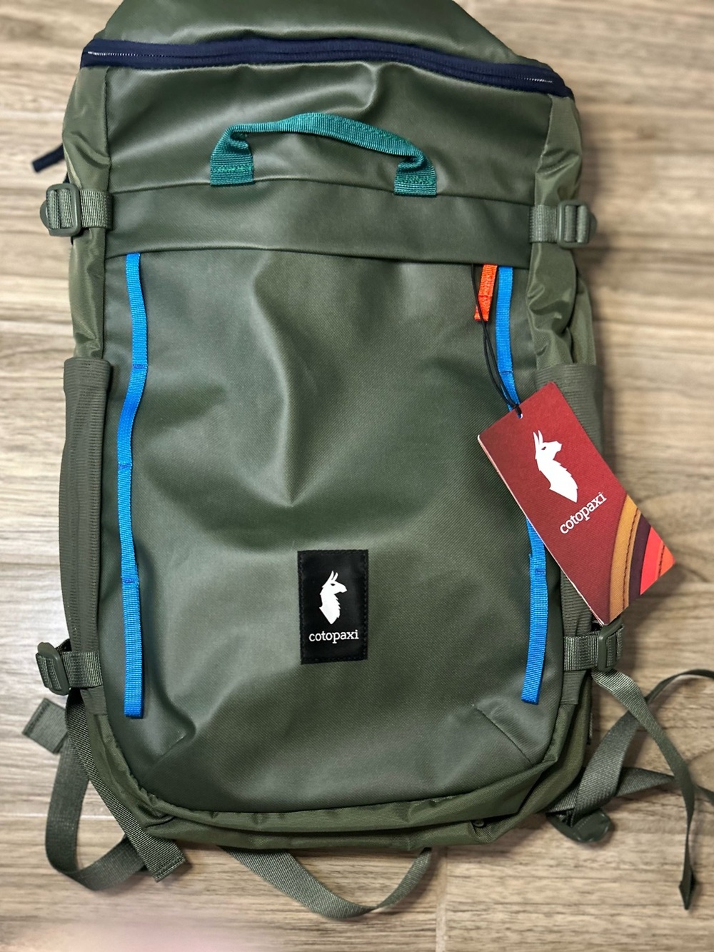 cotopaxi Olive Green Backpack with Blue and Teal Accents